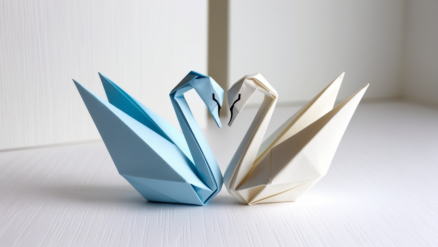 Pair of origami swans symbolizing love and harmony